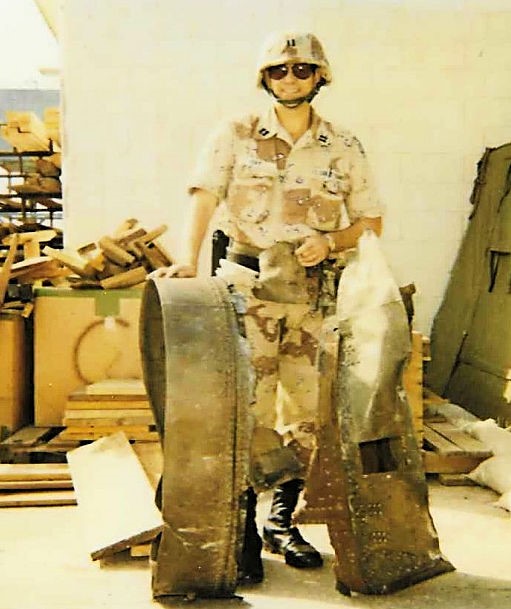 LT Steven Day holding debris from a SCUD missile that was destroyed by the U.S. Patriot Missile Battery located at the port of Ad Dammam, Saudi Arabia. (Courtesy of CAPT John Olson, ret.) LT Steven Day holding debris from a SCUD missile that was destroyed by the U.S. Patriot Missile Battery located at the port of Ad Dammam, Saudi Arabia. (Courtesy of CAPT John Olson, ret.)